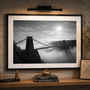 Clifton Suspension Bridge rising above morning fog in the Avon Gorge, presented as black and white wall art from the Bristol Wall Art Clifton Collection.