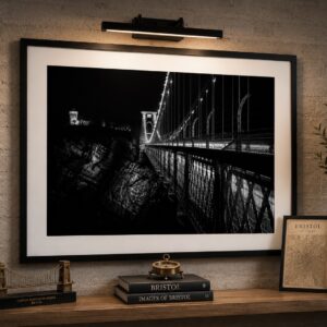 Framed Clifton Suspension Bridge artwork reimagined in black and white at night, displayed in a contemporary interior setting