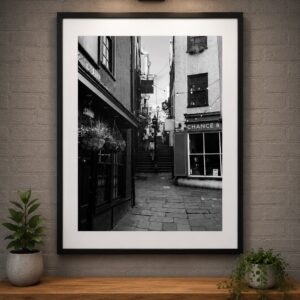 Framed black and white Christmas Steps lower view Bristol wall art print displayed in a contemporary interior.