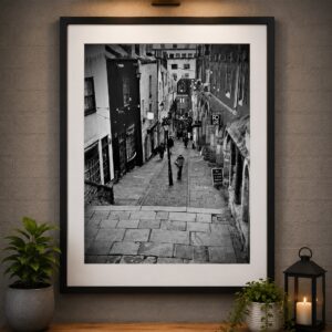 Framed black and white Christmas Steps Bristol wall art print displayed in a modern interior setting.