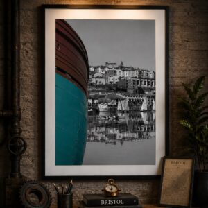 Framed Bristol Harbour wall art print featuring a colour boat against a black and white waterfront reflection scene.
